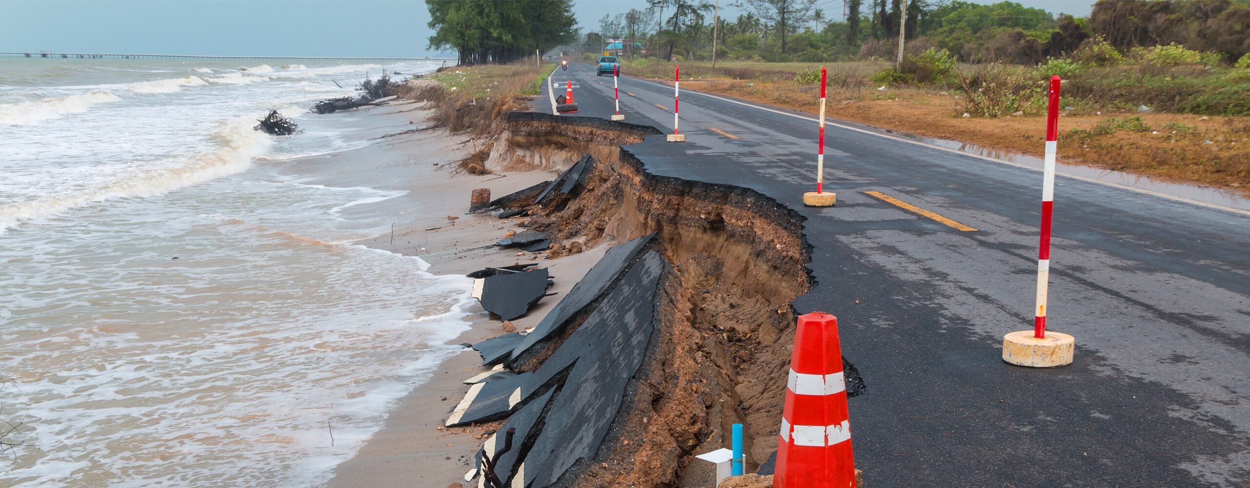 damaged road along coastline because of erosion