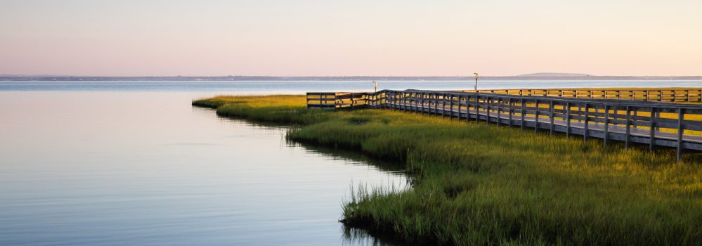 Estuary at sunset with dock